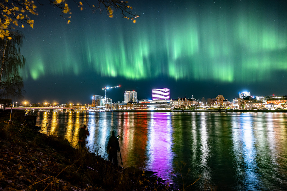 Umeå cityscape in the northern lights.